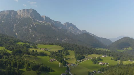 fixed aerial shot of european alps countryside in summer