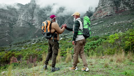 two elderly men hiking in the mountains