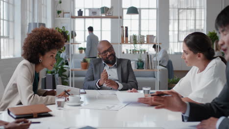 african-american-businessman-executive-meeting-corporate-leaders-discussing-development-ideas-with-shareholders-brainstorming-in-office-boardroom