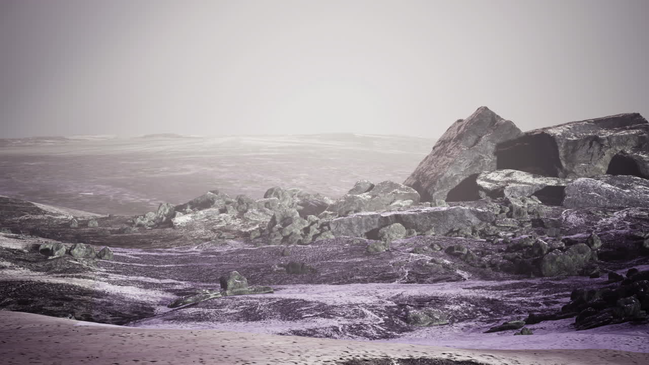 Barren alien landscape with rocky terrain under a pale sky