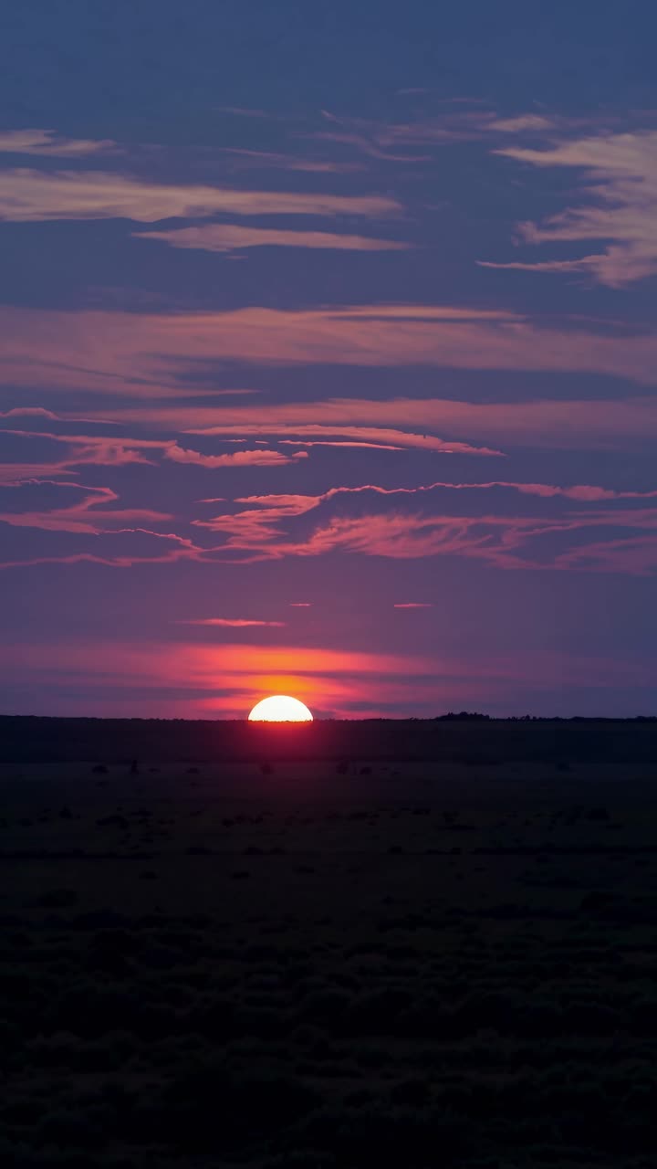A serene sunset video captures the sun dipping below the horizon