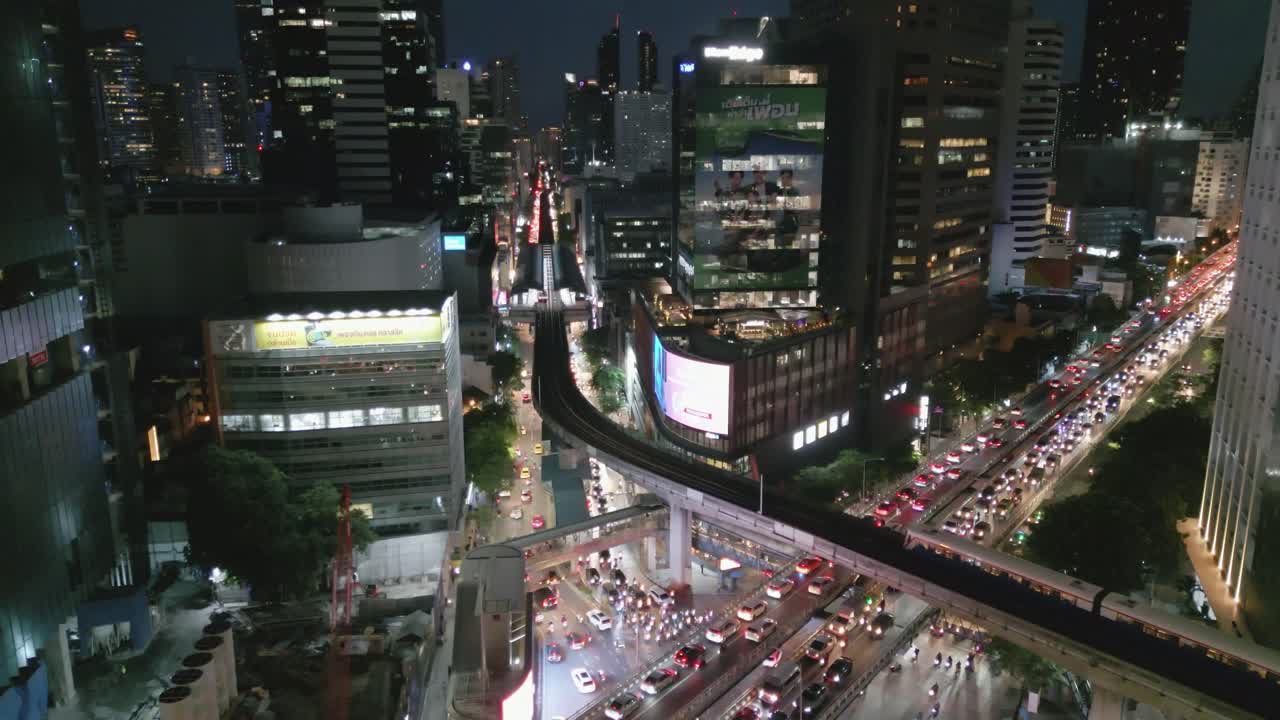 Nighttime Cityscape with Traffic and Elevated Train in Bangkok