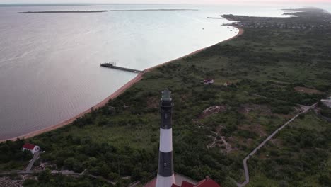 an aerial view of the iconic fire island lighthouse during a colorful sunrise