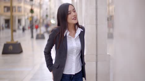 attractive young woman window shopping in town