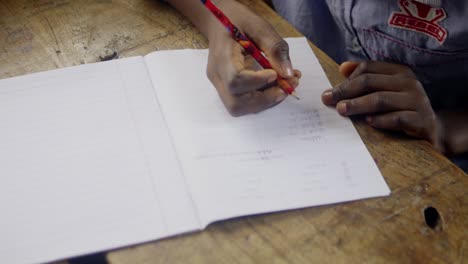 child writing on notepad 01