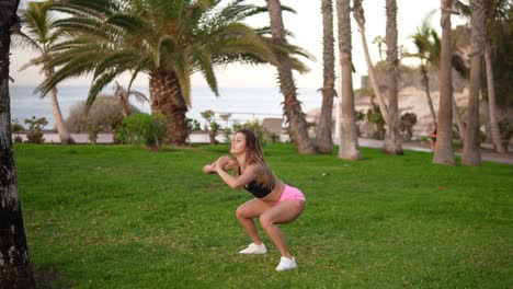 Fitness-Long-Haired-Woman-Does-Sport-Workout-In-At-Tropical-Park