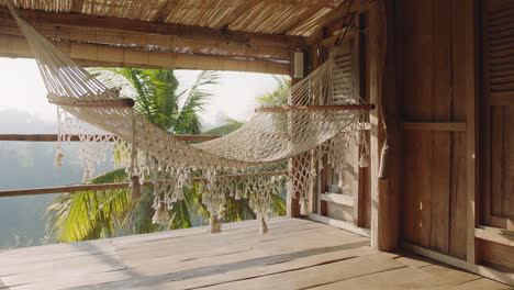 hammock-swinging-empty-cabin-at-tropical-hotel-resort-summer-vacation-in-paradiseexotic-travel-lifestyle-concept-no-people-4k