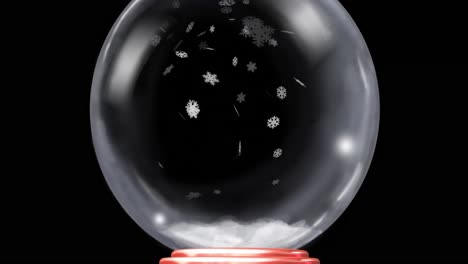 animación del globo de nieve de navidad con nieve cayendo sobre un fondo negro