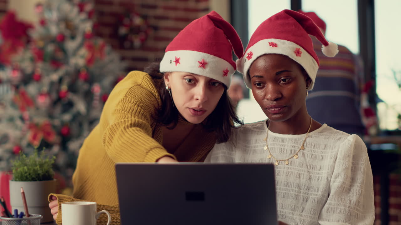 Multiethnic team of coworkers planning report on laptop