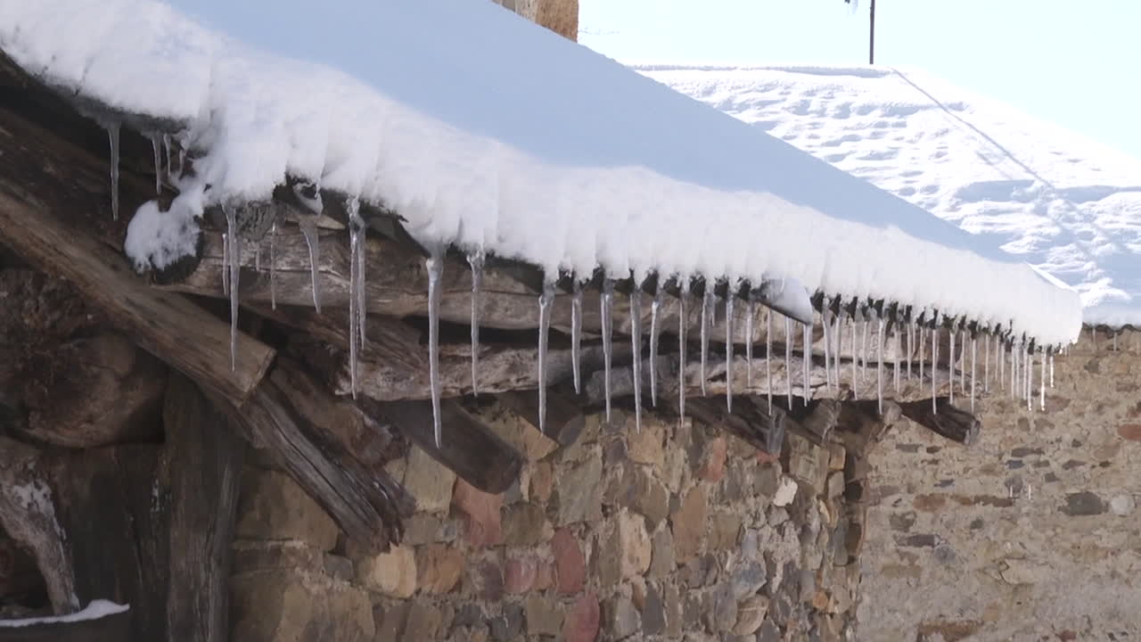 Snowy Roof with Icicles