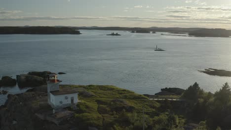 reverse from sunset to reveal lighthouse