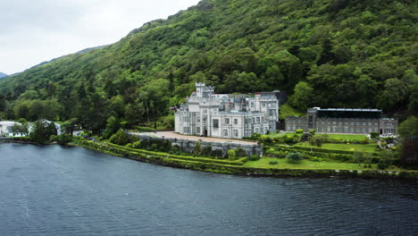 dolly out aerial shot of the beautiful benedictine castle called kylemore abbey