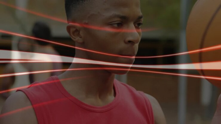 Adult male training basketball skills, hand flicking to spin ball, red streak overlay sweeping ball