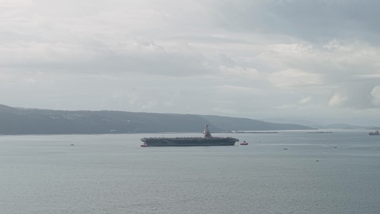 Aerial View Of USS Gerald R. Ford (CVN-78) Aircraft Carrier In Oslo Fjord With Calm Waters In Norway