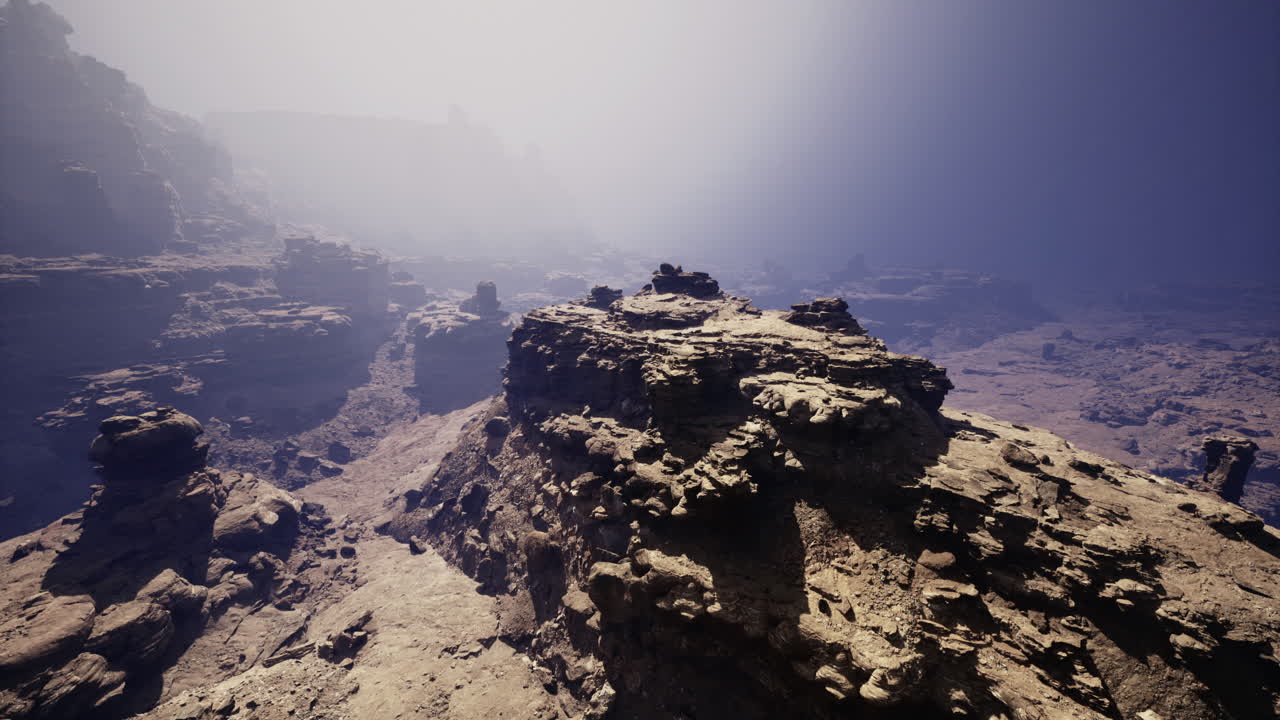Stunning rocky landscape with fog and high cliffs at dawn in a remote location
