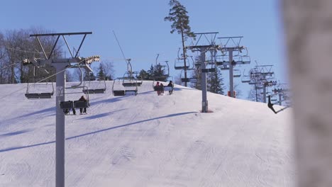 slow motion shot of a ski resorts gondolas, where people move up the mountain