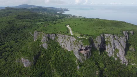 Pan-shot-of-suicide-cliff-in-Saipan,-Northern-Mariana-Islands-during-a-sunny-morning