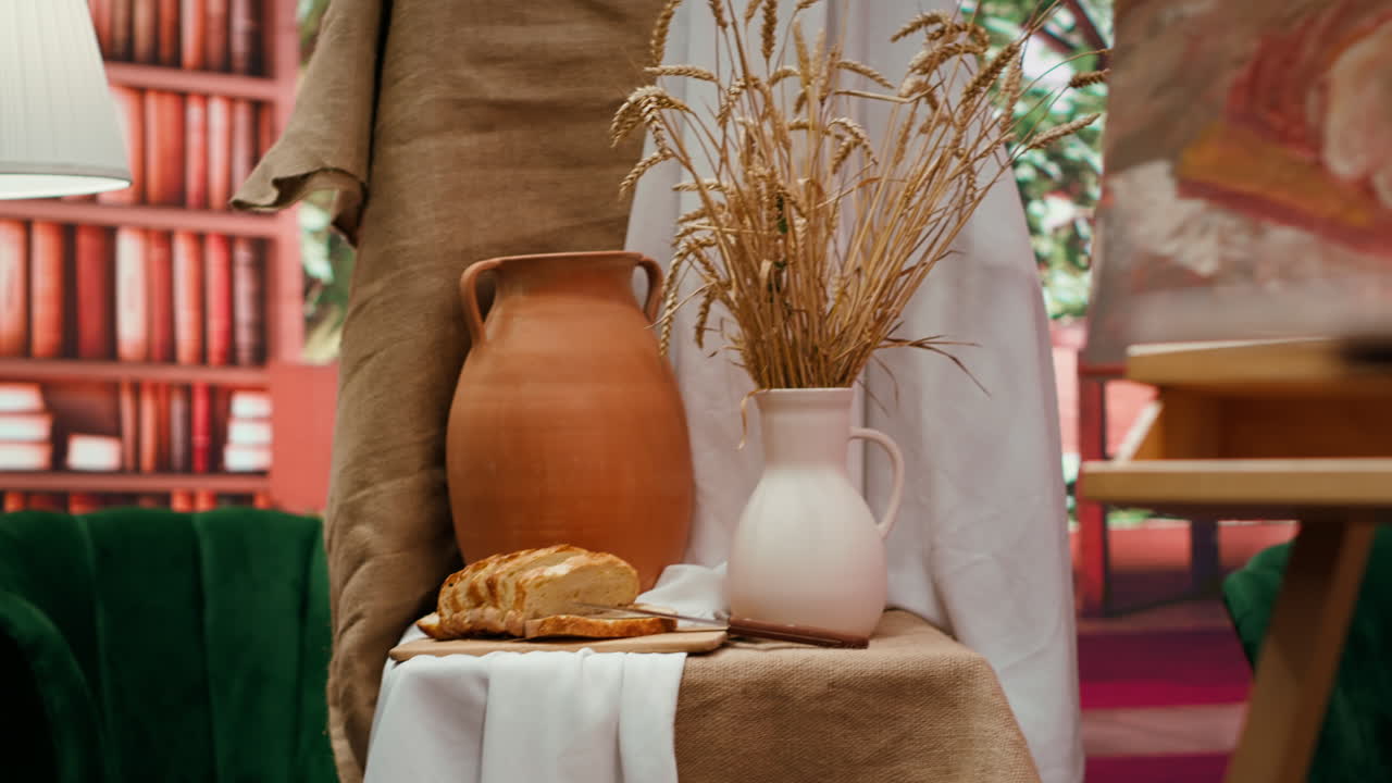 Still life with bread, jug, wheat, and painting