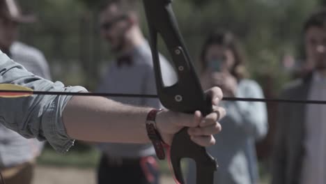 man holding a bow and arrow