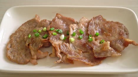 grilled pork neck sliced on plate in asian style