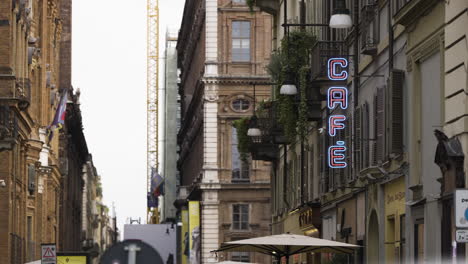 static shot of random italian street with a cafe sign