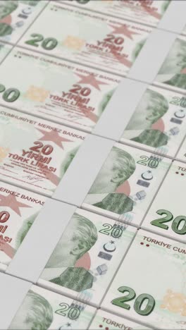 vertical video of 20 turkish lira banknotes printing by a money press
