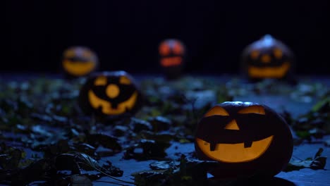 scary pumpkins for halloween glow in the foggy forest