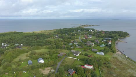 drone plan of estonian village by the sea at the top of a cape