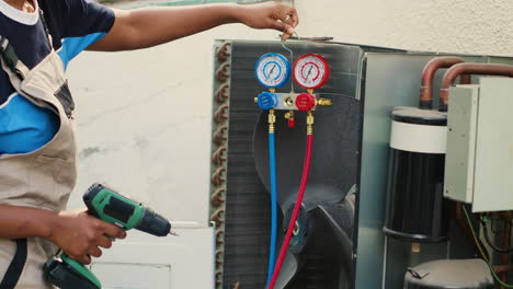 Electrician-working-on-air-conditioner