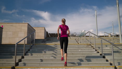 woman running up stairs