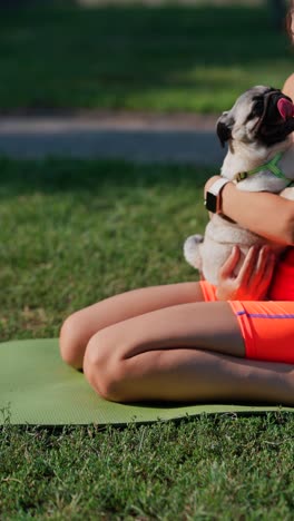 girl with pug in park