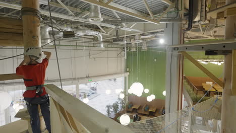 child climbing in an indoor adventure park