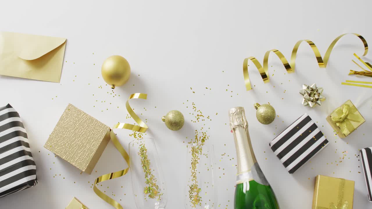 Decorations and champagne on white background at new year's eve