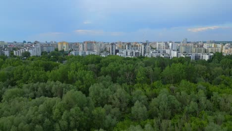 Aerial-reveal,-Warsaw-city,-developing-region,-nature,-blue-sky-backdrop