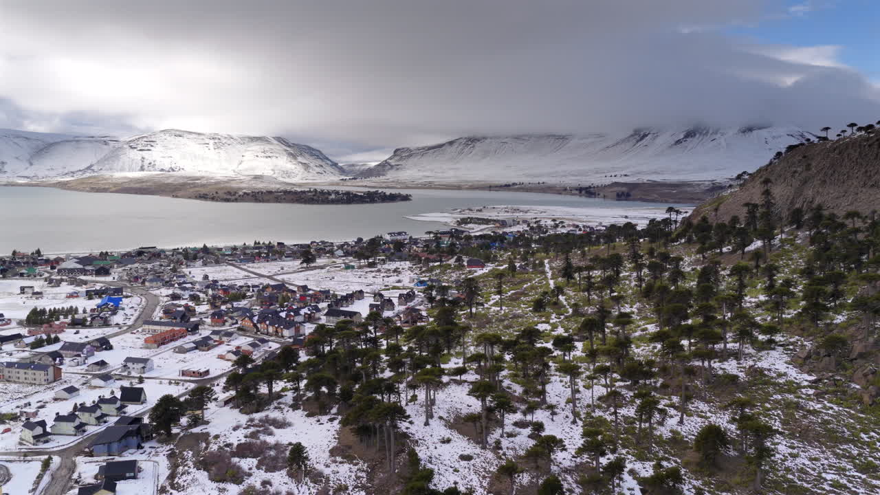 Snow covered mountain Caviahue village with scattered trees in winter season, Caviahue, Neuquén, Argentina