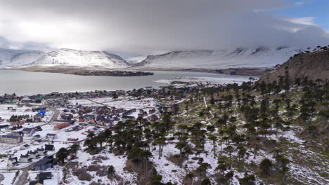 snow covered mountain caviahue village with scattered trees in winter season, caviahue, neuquén, argentina