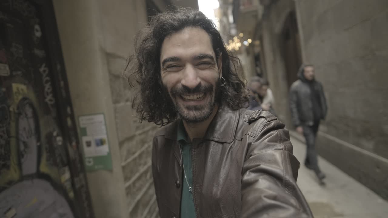 Man smiling in an alley