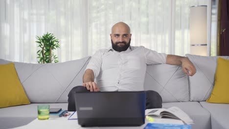home office worker man looking nervously at camera.