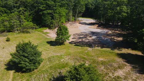 Descent-with-drone-near-a-parking-lot-under-construction