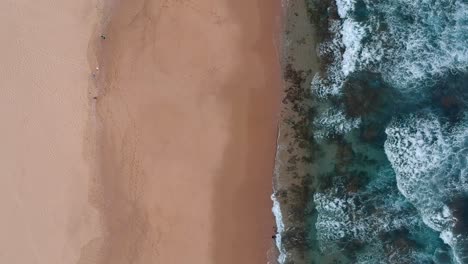 Arial-view-of-beautiful-shoreline,-birds-eye-view-flying-along-the-coast