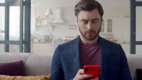 Focused-business-man-thinking-and-getting-an-idea-on-phone-at-home-office