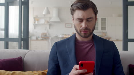 Focused business man thinking and getting an idea on phone at home office