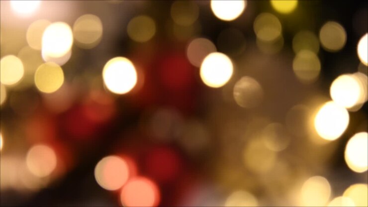 Christmas lights, shimmering abstract golden warm circles defocused. Blurred fairy lights. Out of focus holiday background. Light bokeh from Xmas tree. New Year theme, background 4k footage