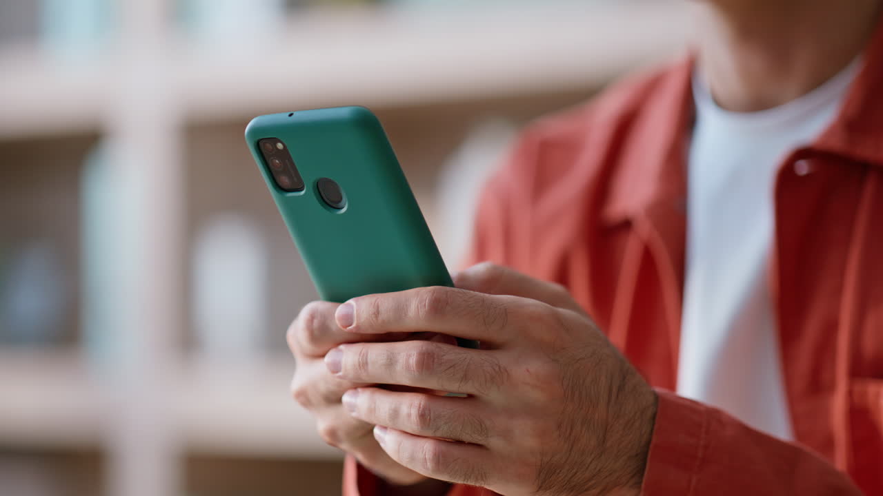 Startuper hands texting smartphone at business office closeup. Man typing
