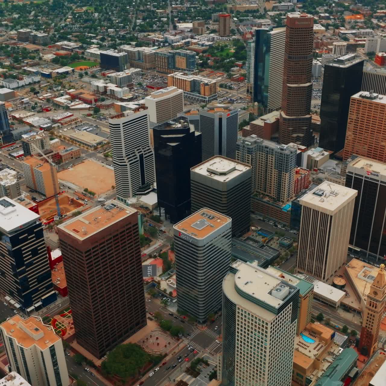 Looking at the tops of gorgeous skyscrapers in Denver downtown. Urban cityscape from bird's eye perspective