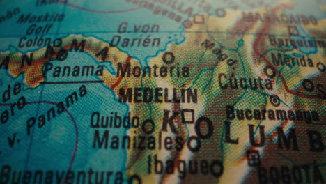 close-up of a world map showing medellin, colombia
