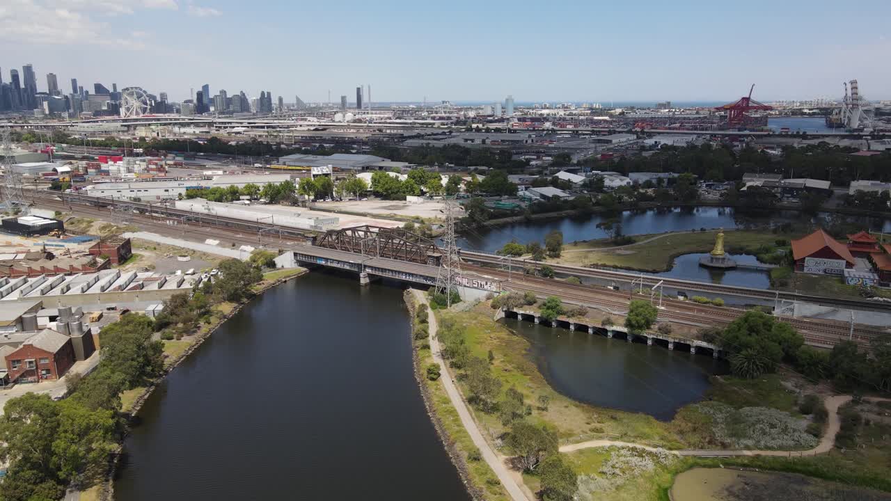 Aerial drone above Maribyrnong River, Melbourne, under a cloudy sky