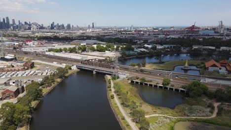 aerial drone above maribyrnong river, melbourne, under a cloudy sky