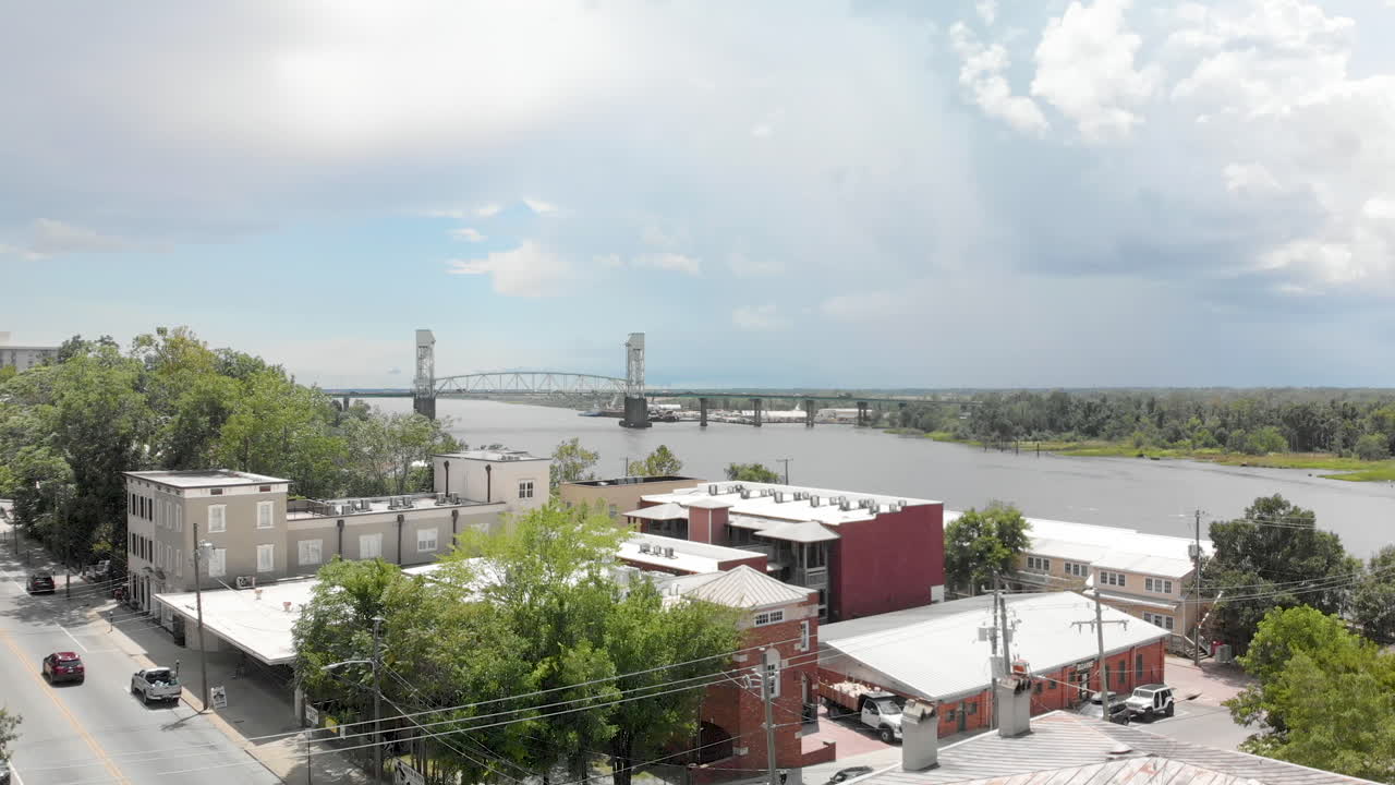 Wilmington port city ascending aerial revealing Cape Fear memorial bridge Aerial 4k