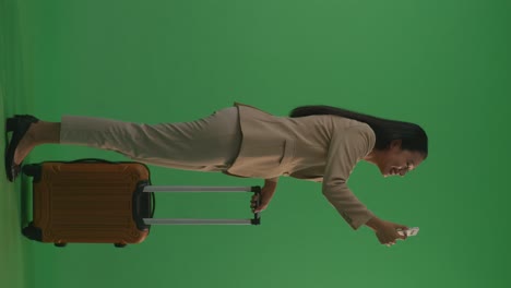 businesswoman with luggage and mobile phone